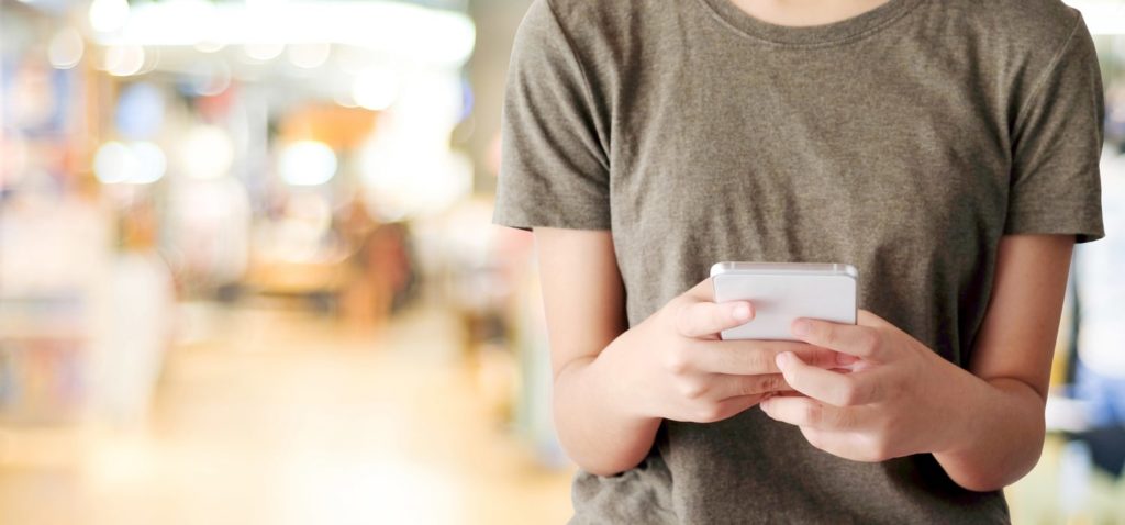 Woman searching on mobile device.