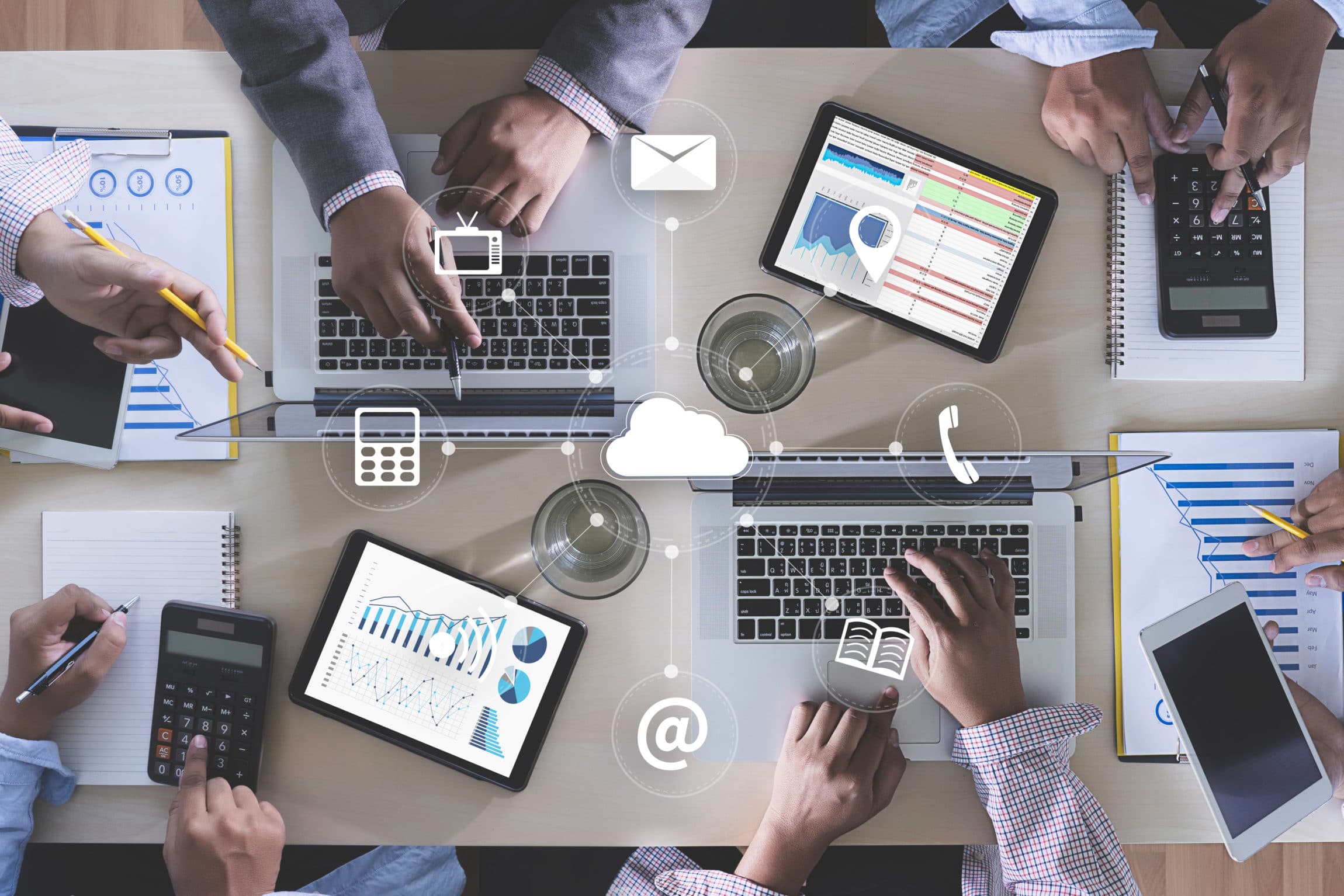 Business team hands at work with financial reports and a laptop looking at google search ads.